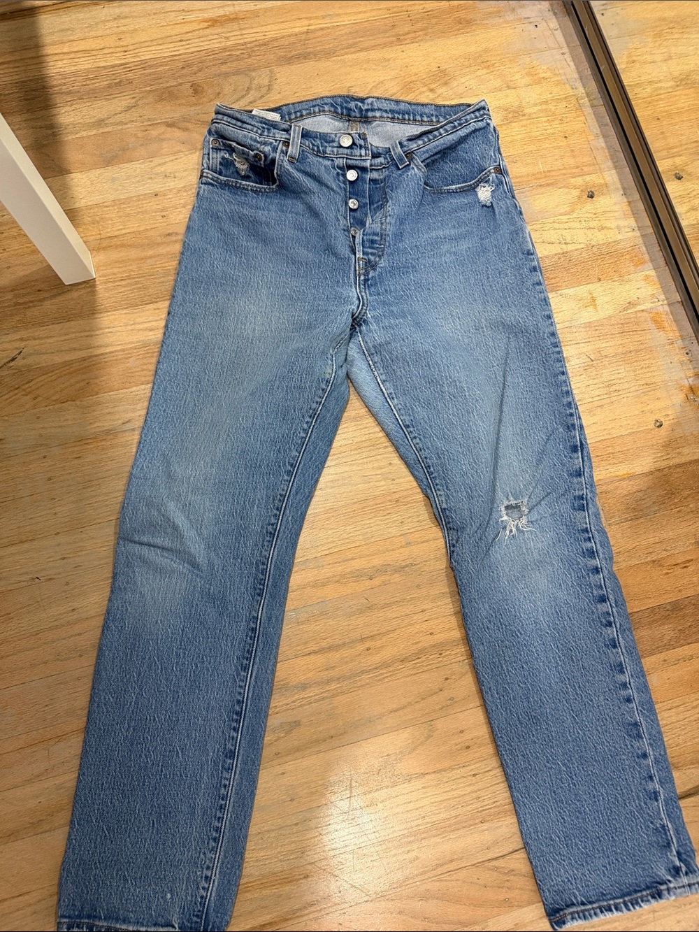 Levi's Straight Leg Jeans in Light Blue with Distressed Details